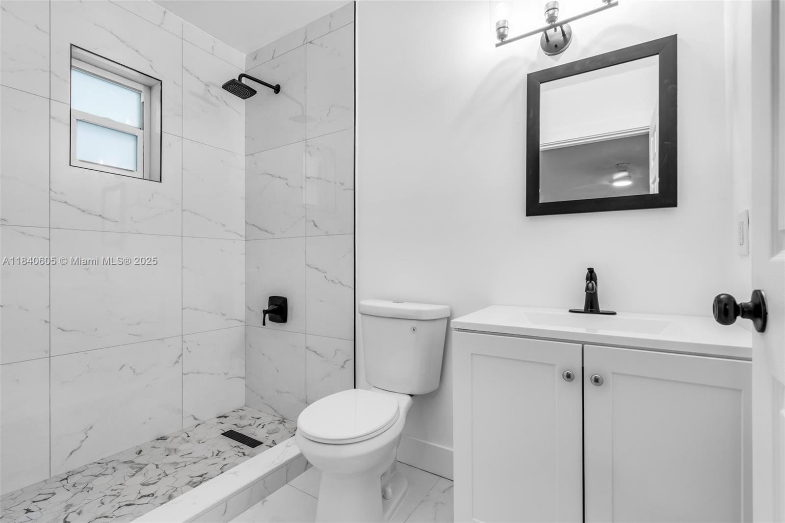 1050 Superior Street Opa-Locka, FL 33054 - Photo 11 of 20 a bathroom with a toilet sink and shower