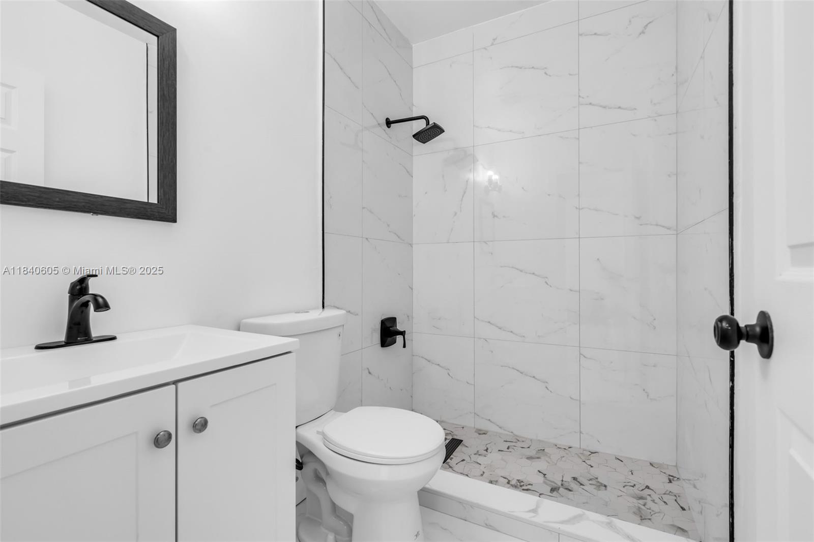 1050 Superior Street Opa-Locka, FL 33054 - Photo 16 of 20 a bathroom with a sink toilet and shower