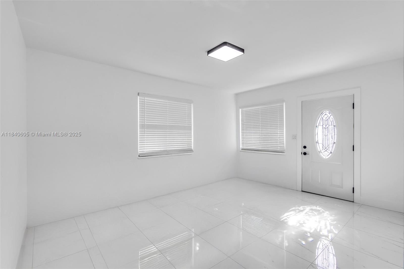 1050 Superior Street Opa-Locka, FL 33054 - Photo 17 of 20 a view of an empty room with a window