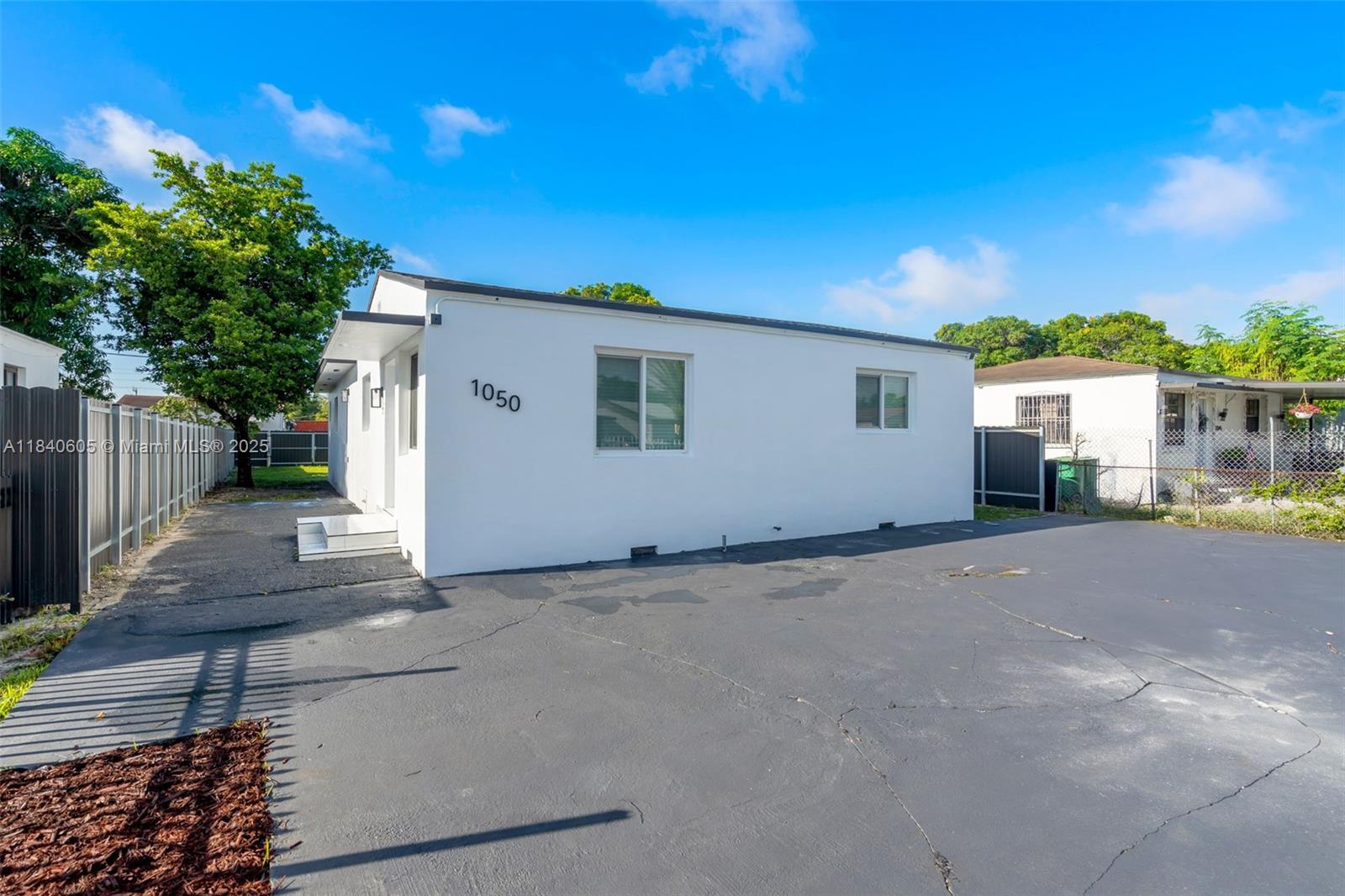 1050 Superior Street Opa-Locka, FL 33054 - Photo 2 of 20 a view of a house with a backyard