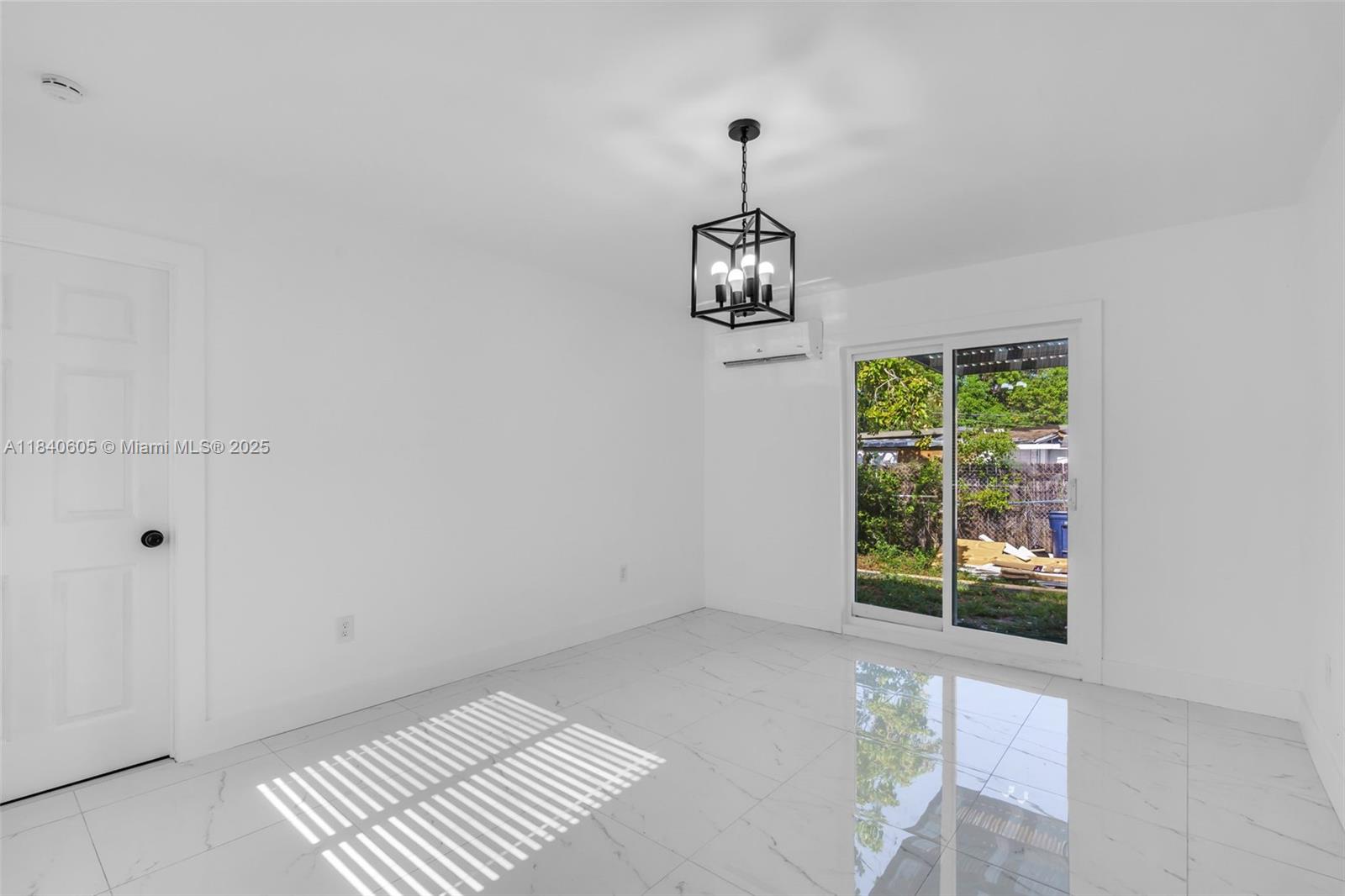 1050 Superior Street Opa-Locka, FL 33054 - Photo 7 of 20 a view of empty room with window