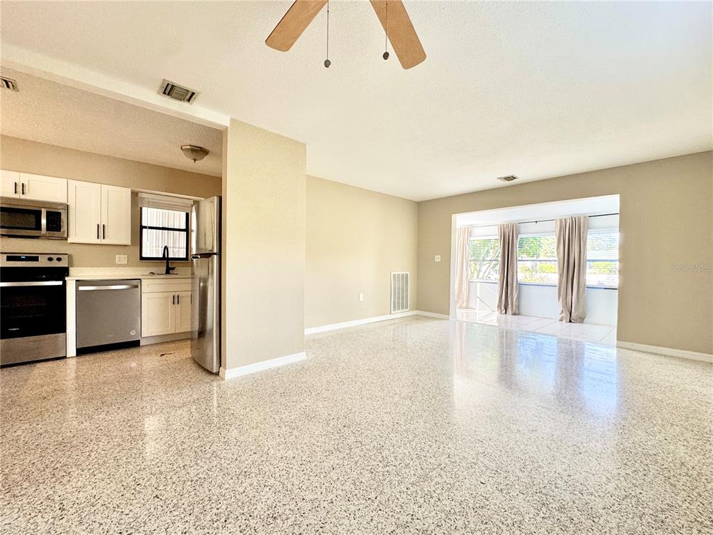 4335 Floramar Terrace New Port Richey, FL 34652 - Photo 15 of 30 a view of a kitchen with a sink dishwasher and a refrigerator