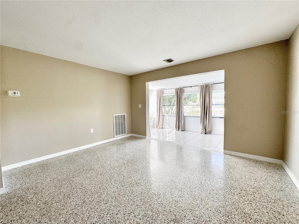 4335 Floramar Terrace New Port Richey, FL 34652 - Photo 16 of 30 a view of an empty room with a window