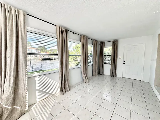 a view of a livingroom with wooden floor and cabinet