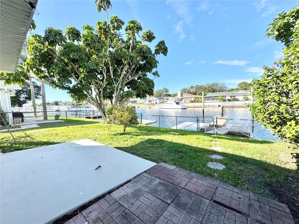 4335 Floramar Terrace New Port Richey, FL 34652 - Photo 27 of 30 a view of a swimming pool and a yard