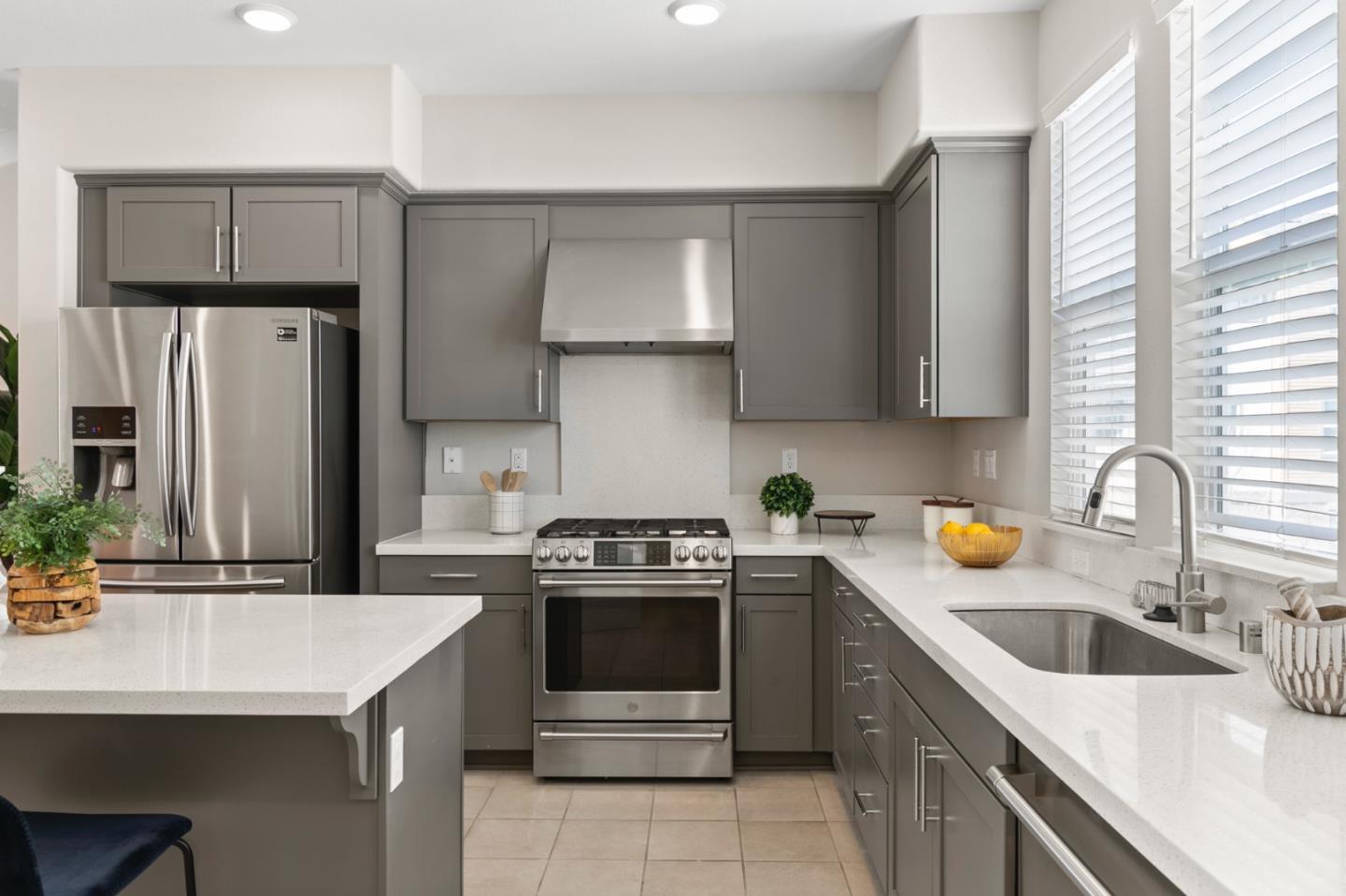 875 Cotati Terrace, Unit 3 Sunnyvale, CA 94085 - Photo 11 of 36 a kitchen with a sink a stove and refrigerator