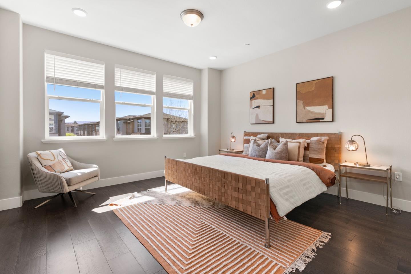 875 Cotati Terrace, Unit 3 Sunnyvale, CA 94085 - Photo 13 of 36 a spacious bedroom with a bed and wooden floor