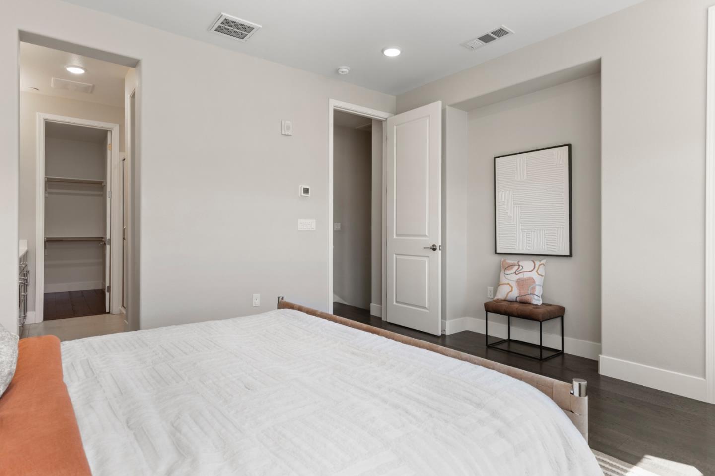 875 Cotati Terrace, Unit 3 Sunnyvale, CA 94085 - Photo 16 of 36 a bedroom with a bed and a lamp