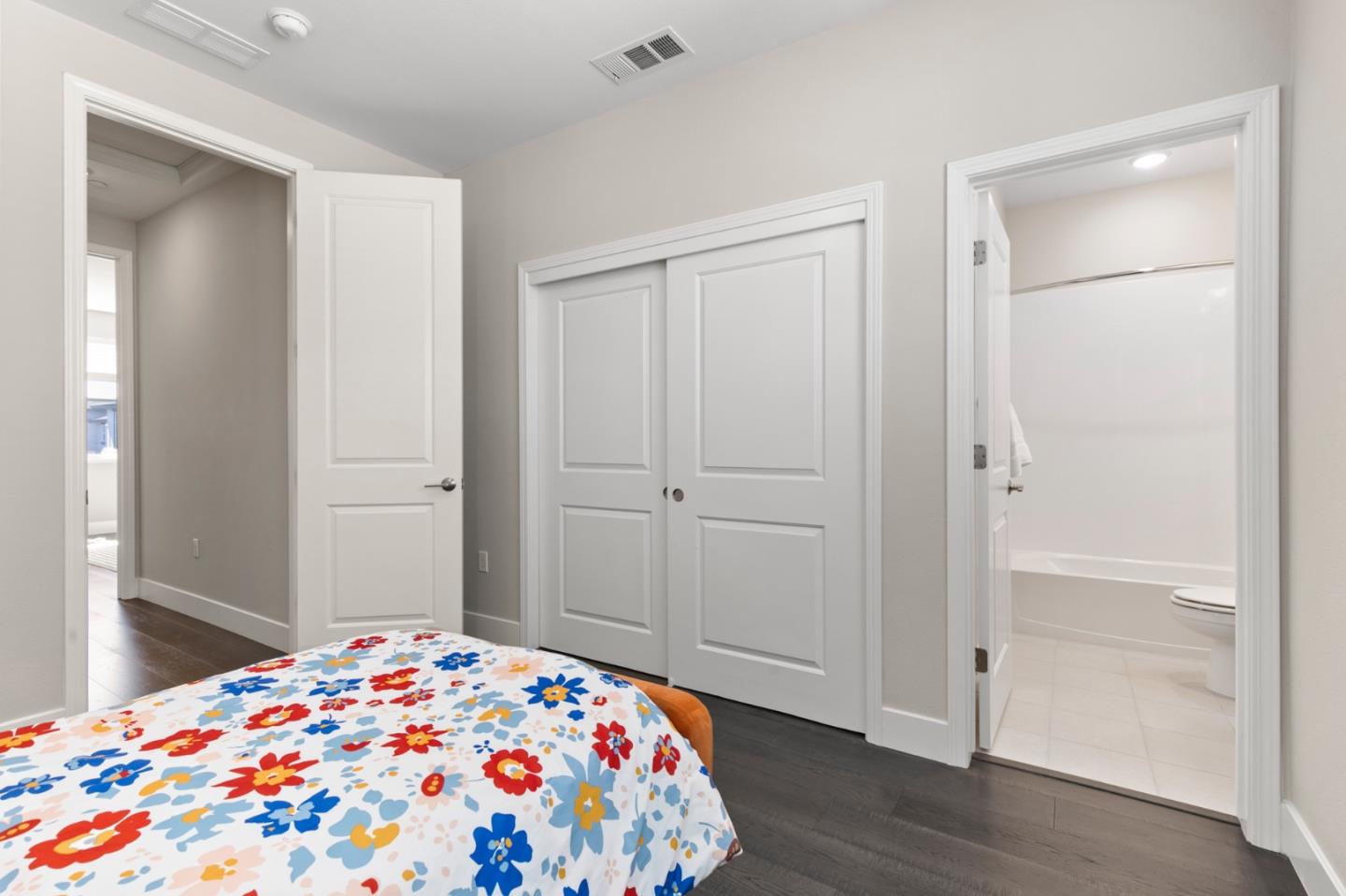 875 Cotati Terrace, Unit 3 Sunnyvale, CA 94085 - Photo 21 of 36 a bedroom with a bed and wooden floor