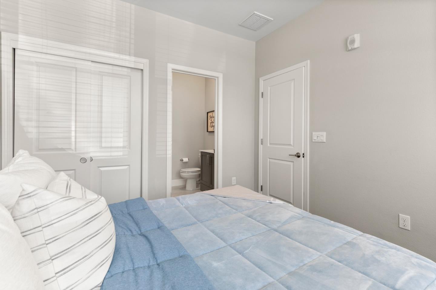 875 Cotati Terrace, Unit 3 Sunnyvale, CA 94085 - Photo 27 of 36 a bedroom with a bed and a window