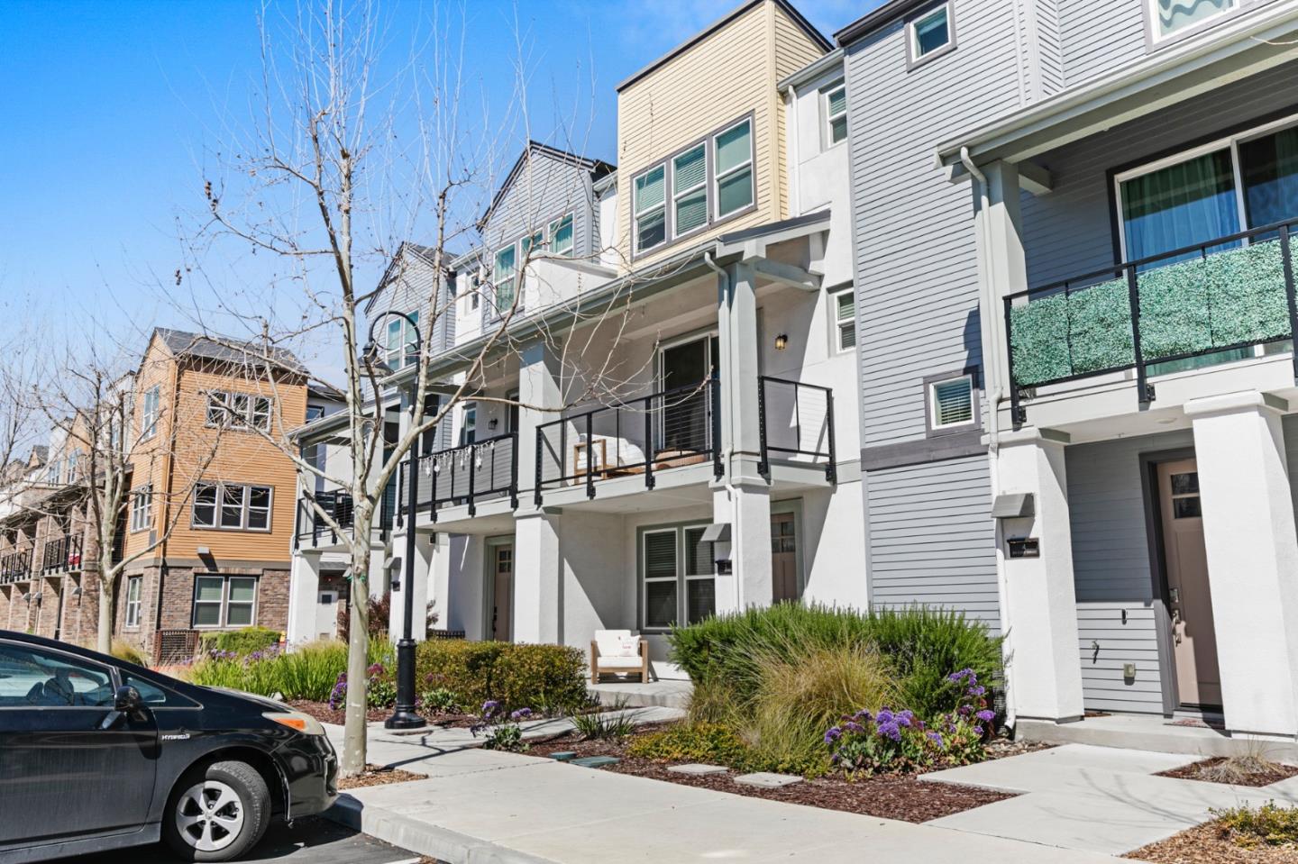 875 Cotati Terrace, Unit 3 Sunnyvale, CA 94085 - Photo 33 of 36 a front view of a building with parking area