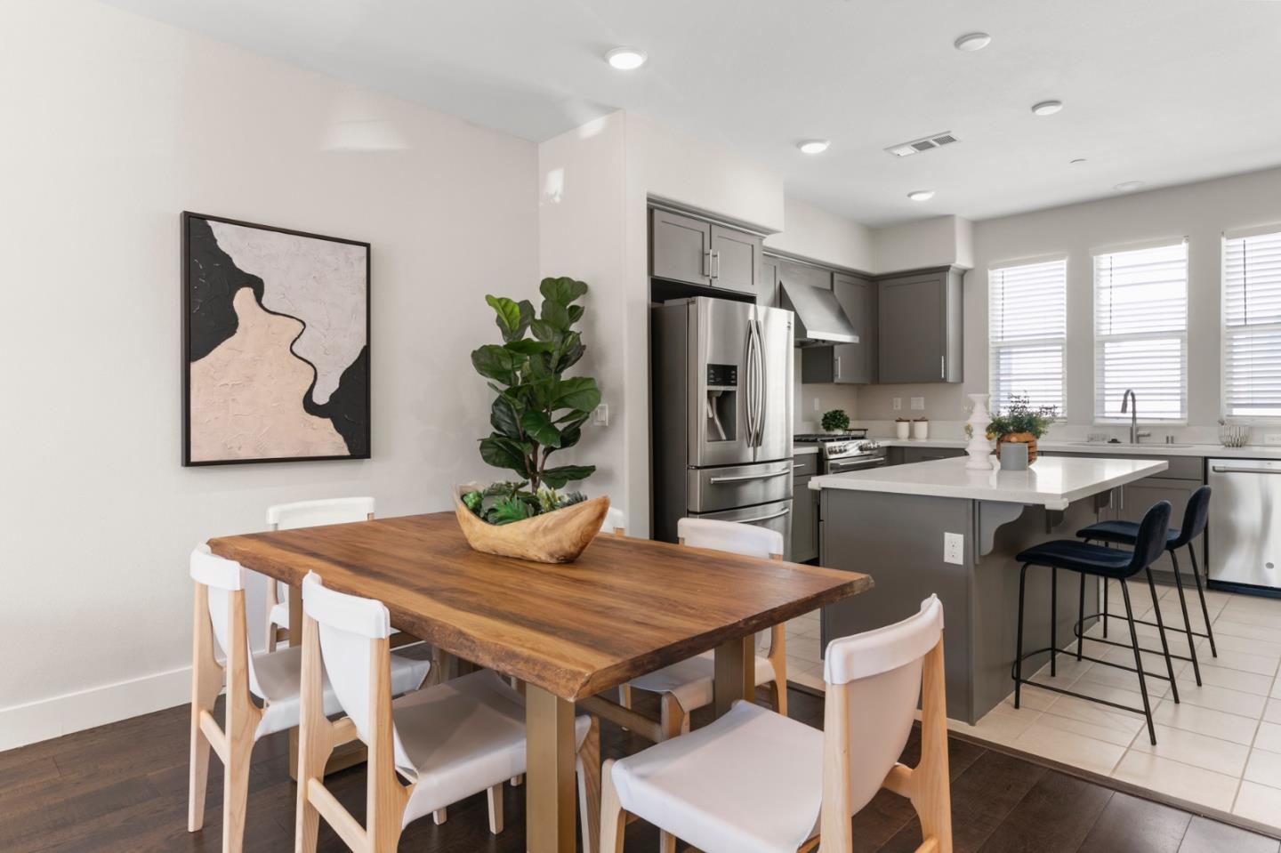 875 Cotati Terrace, Unit 3 Sunnyvale, CA 94085 - Photo 7 of 36 a dining table with chairs and kitchen view