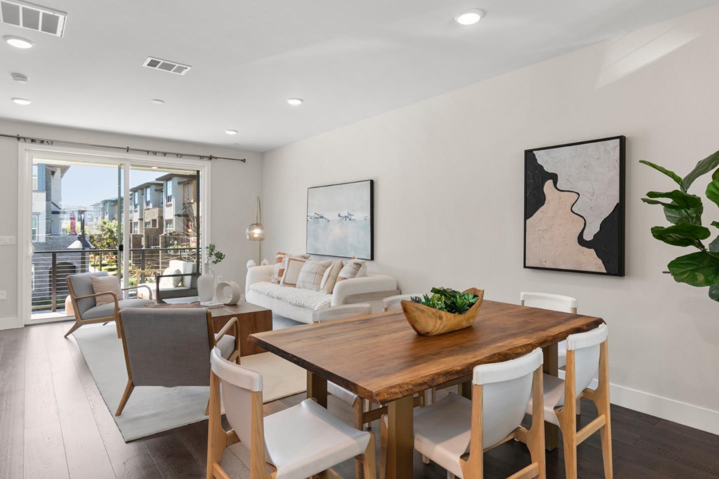 875 Cotati Terrace, Unit 3 Sunnyvale, CA 94085 - Photo 8 of 36 a view of a dining room with furniture large window and wooden floor