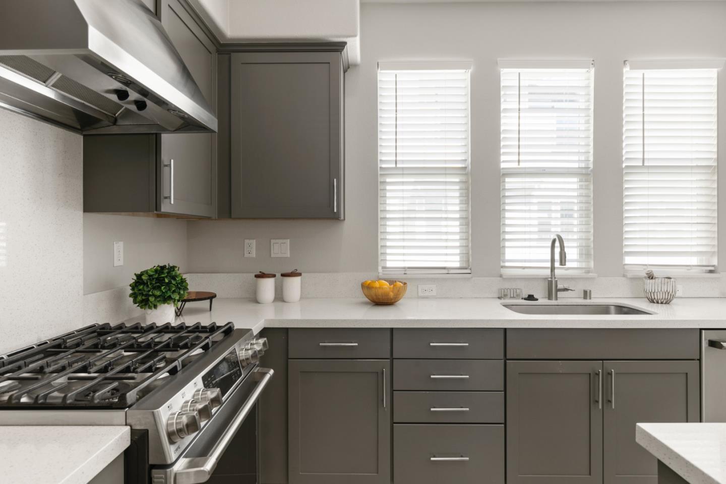 875 Cotati Terrace, Unit 3 Sunnyvale, CA 94085 - Photo 9 of 36 a kitchen with stainless steel appliances a sink a stove and a window
