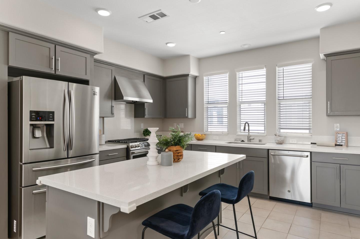875 Cotati Terrace, Unit 3 Sunnyvale, CA 94085 - Photo 10 of 36 a kitchen with stainless steel appliances a sink a stove a refrigerator cabinets and a window