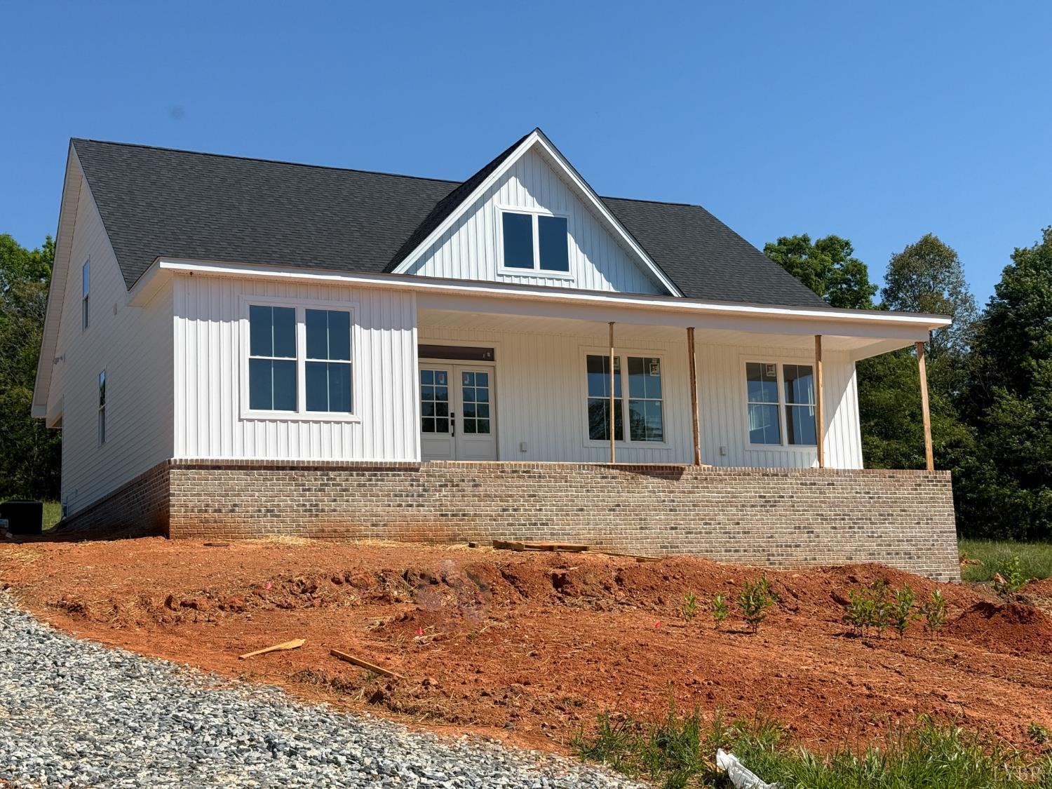 9009 Stonewall Road Appomattox, VA 24522 - Photo 1 of 38 a front view of a house with a yard