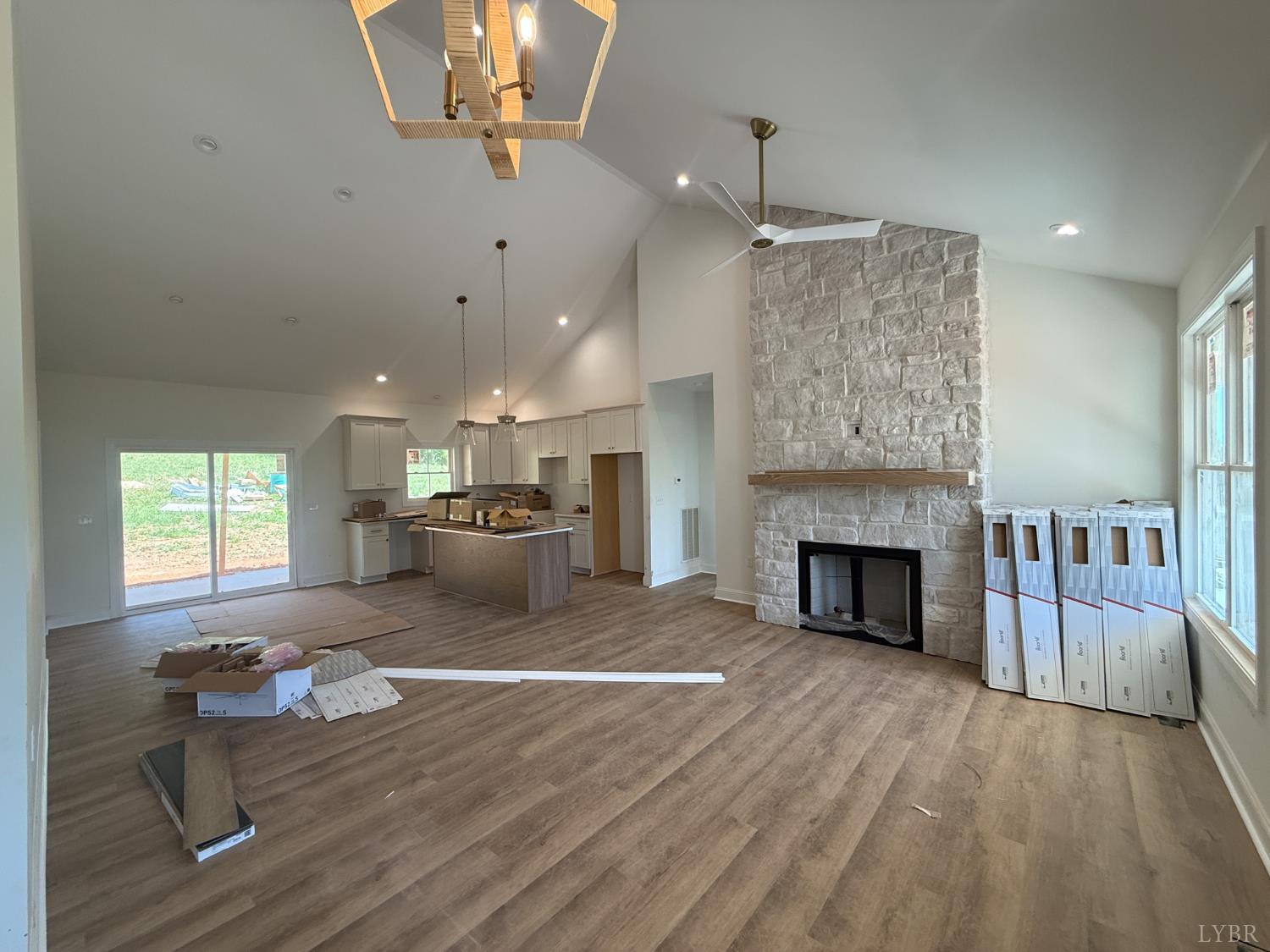 9009 Stonewall Road Appomattox, VA 24522 - Photo 11 of 38 a living room with furniture and a fireplace