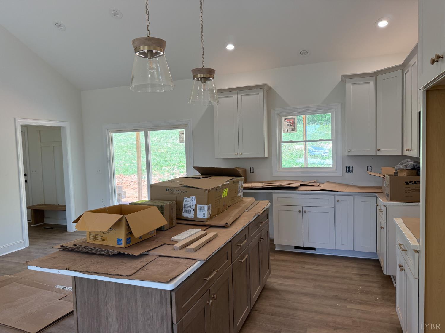 9009 Stonewall Road Appomattox, VA 24522 - Photo 12 of 38 a kitchen with kitchen island granite countertop a sink cabinets and window