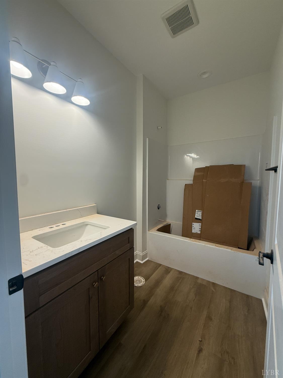 9009 Stonewall Road Appomattox, VA 24522 - Photo 17 of 38 a kitchen with a sink and mirror