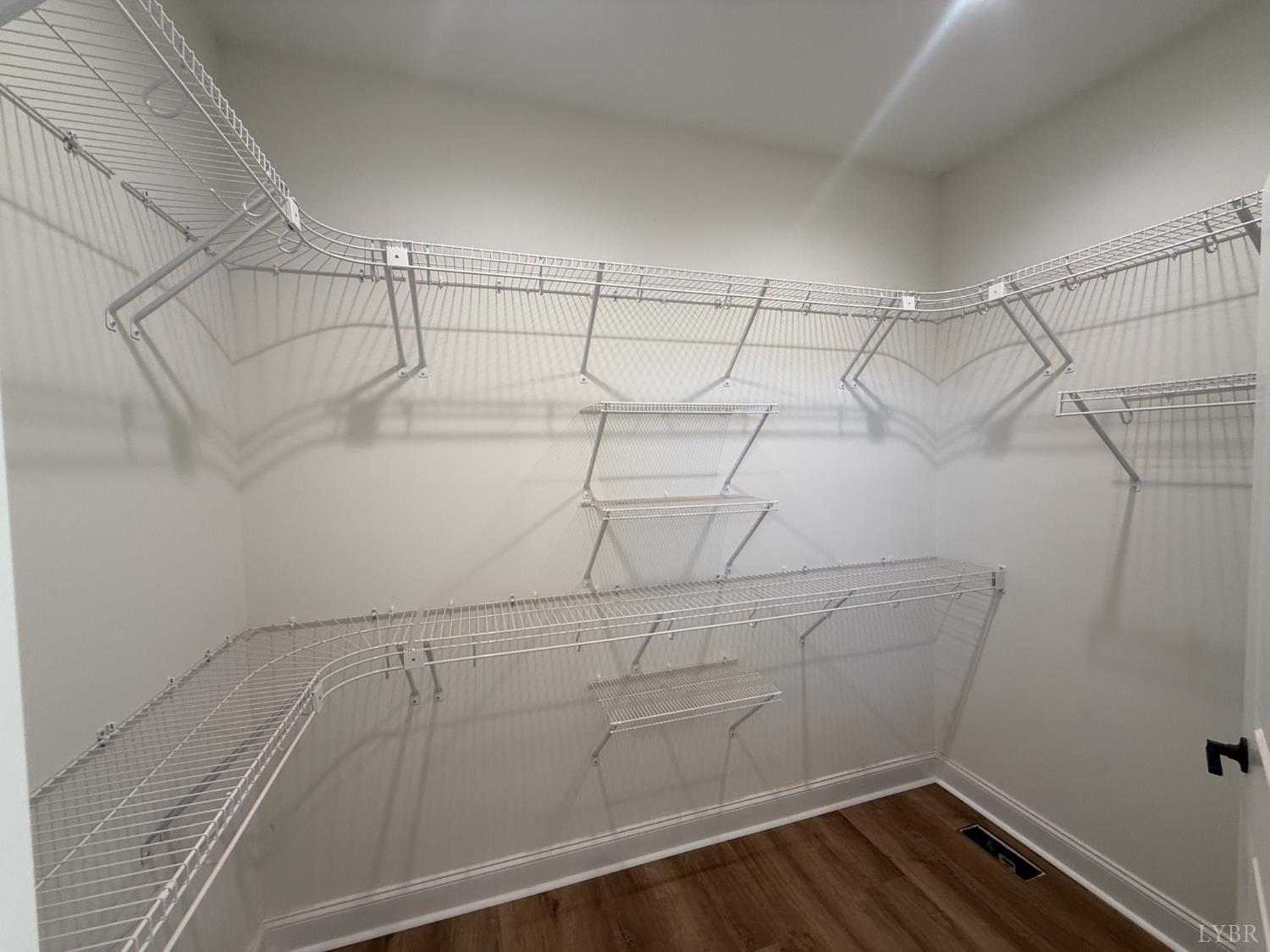 9009 Stonewall Road Appomattox, VA 24522 - Photo 20 of 38 a view of a room with racks on the wall