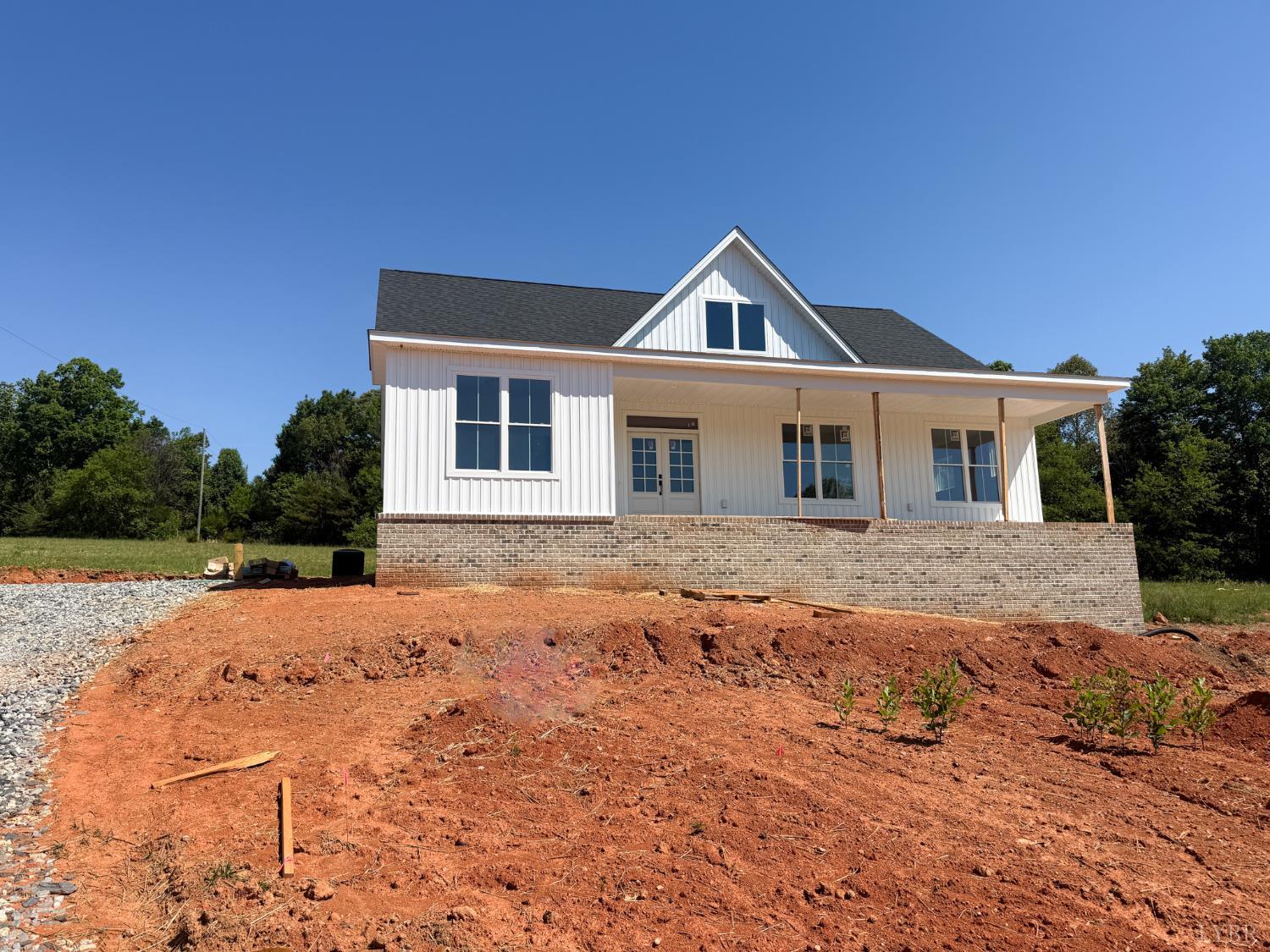 9009 Stonewall Road Appomattox, VA 24522 - Photo 2 of 38 a front view of a house with a yard
