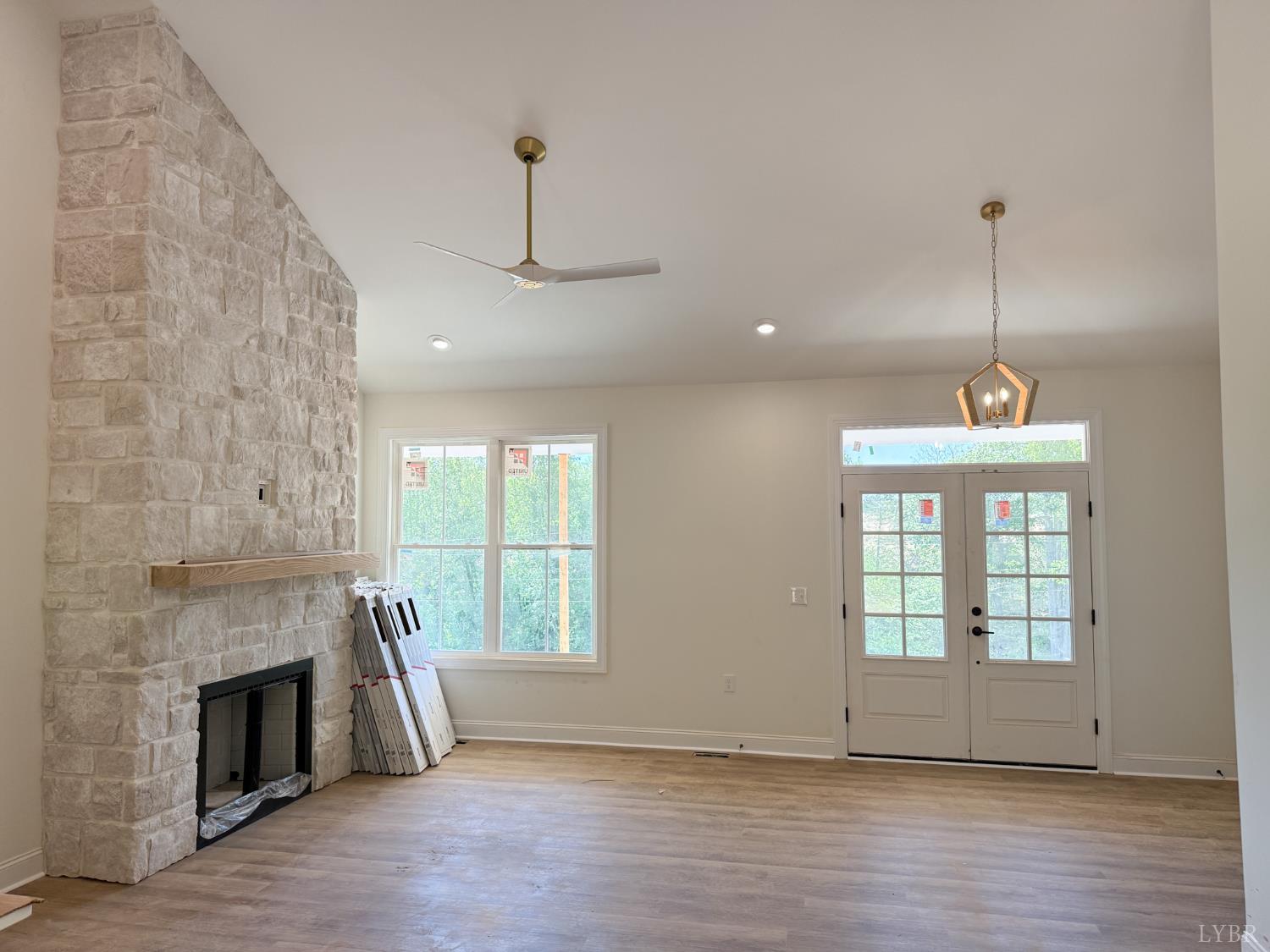 9009 Stonewall Road Appomattox, VA 24522 - Photo 7 of 38 a view of an empty room with a window and fireplace