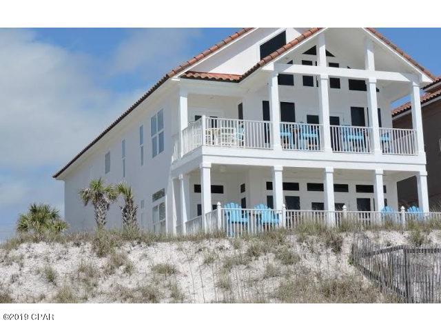 a view of a building with a yard