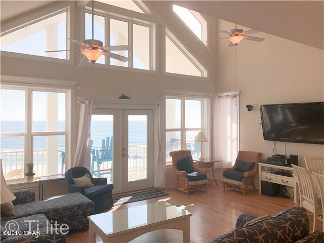 21605 Front Beach Road Panama City Beach, FL 32413 - Photo 16 of 17 a living room with furniture and a flat screen tv