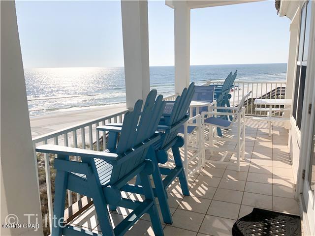 21605 Front Beach Road Panama City Beach, FL 32413 - Photo 4 of 17 a view of a balcony with table and chairs