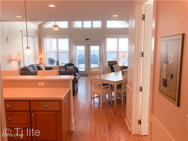 21605 Front Beach Road Panama City Beach, FL 32413 - Photo 6 of 17 a dining hall with stainless steel appliances a table and chairs