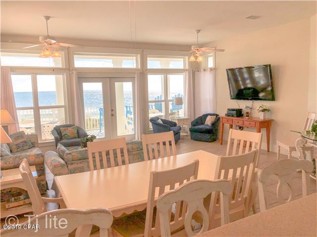 21605 Front Beach Road Panama City Beach, FL 32413 - Photo 7 of 17 a living room with furniture a flat screen tv and large windows