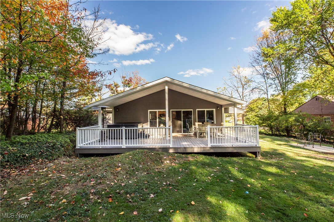 2430 Rockside Road Independence, OH 44131 - Photo 37 of 46 Back of house featuring a wooden deck and a lawn