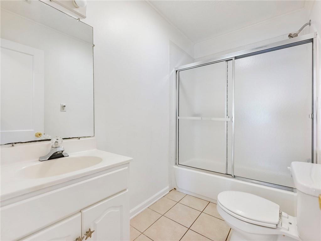 1686 Shoal Creek Road Monroe, GA 30656 - Photo 17 of 50 a bathroom with a sink a toilet and shower