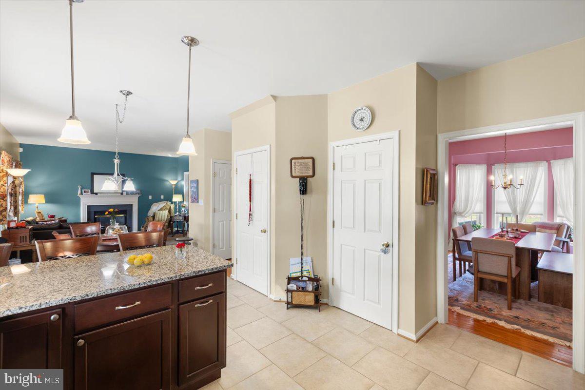 334 Friendship Lane Gettysburg, PA 17325 - Photo 21 of 64 a kitchen with stainless steel appliances granite countertop a refrigerator a sink and a view of living room