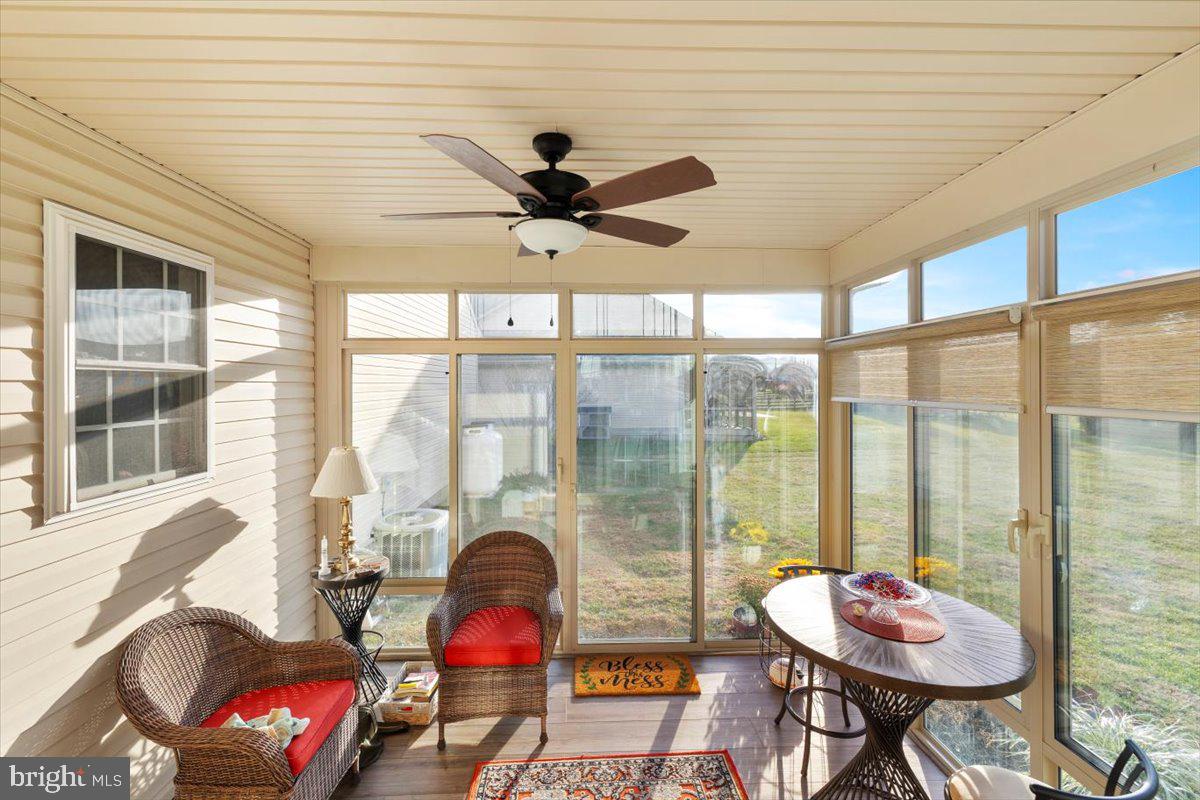 334 Friendship Lane Gettysburg, PA 17325 - Photo 31 of 64 a living room with furniture and a floor to ceiling window