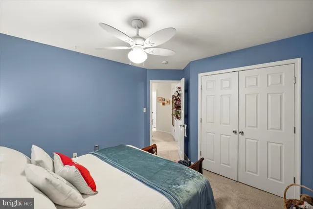 a spacious bathroom with a double vanity sink mirror and toilet