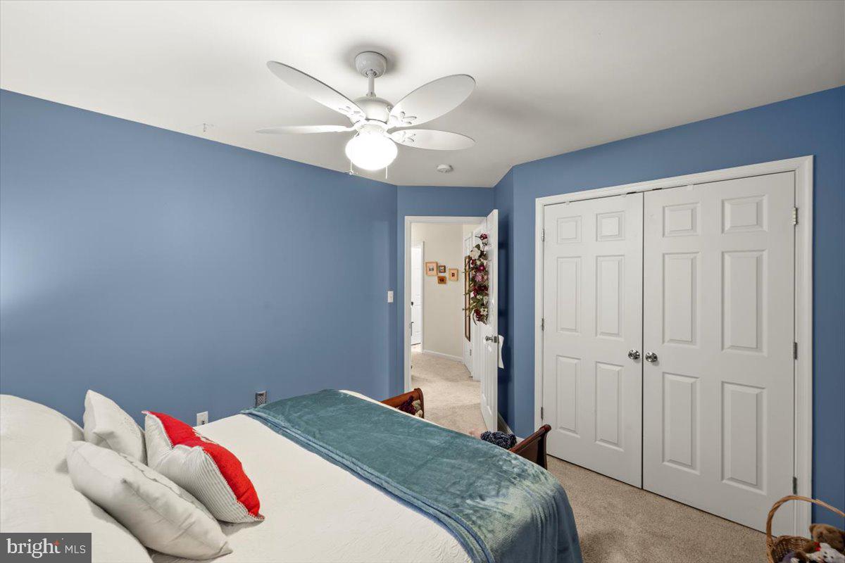 334 Friendship Lane Gettysburg, PA 17325 - Photo 38 of 64 a bedroom with a bed and a chandelier