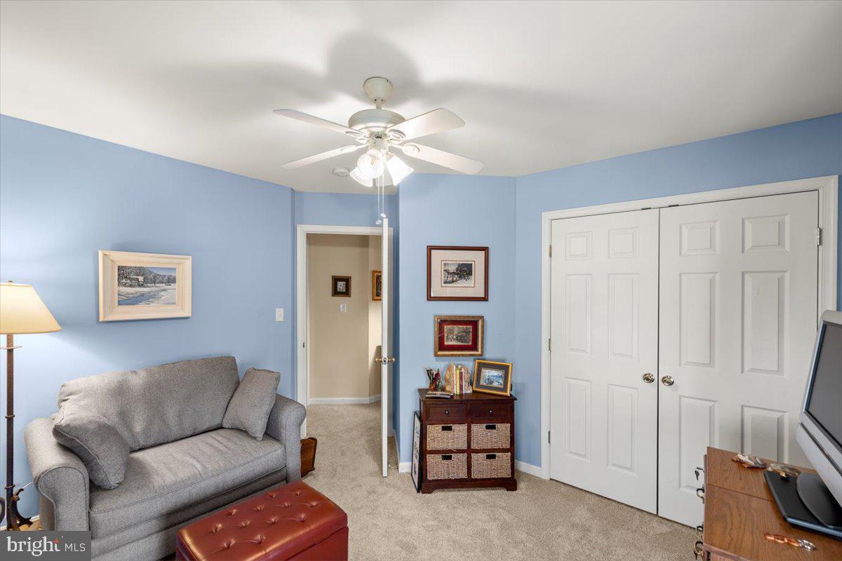 334 Friendship Lane Gettysburg, PA 17325 - Photo 40 of 64 a living room with furniture and a chandelier
