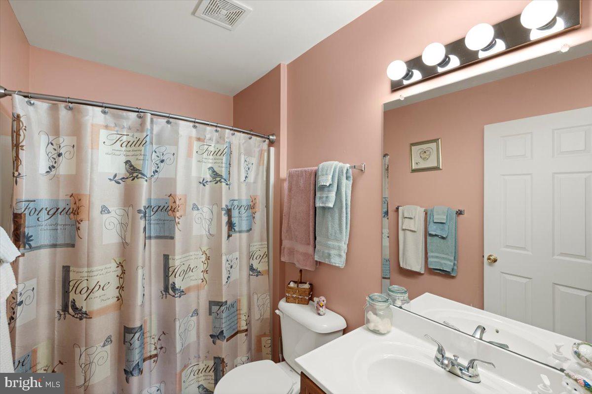 334 Friendship Lane Gettysburg, PA 17325 - Photo 43 of 64 a bathroom with a double vanity sink toilet and shower