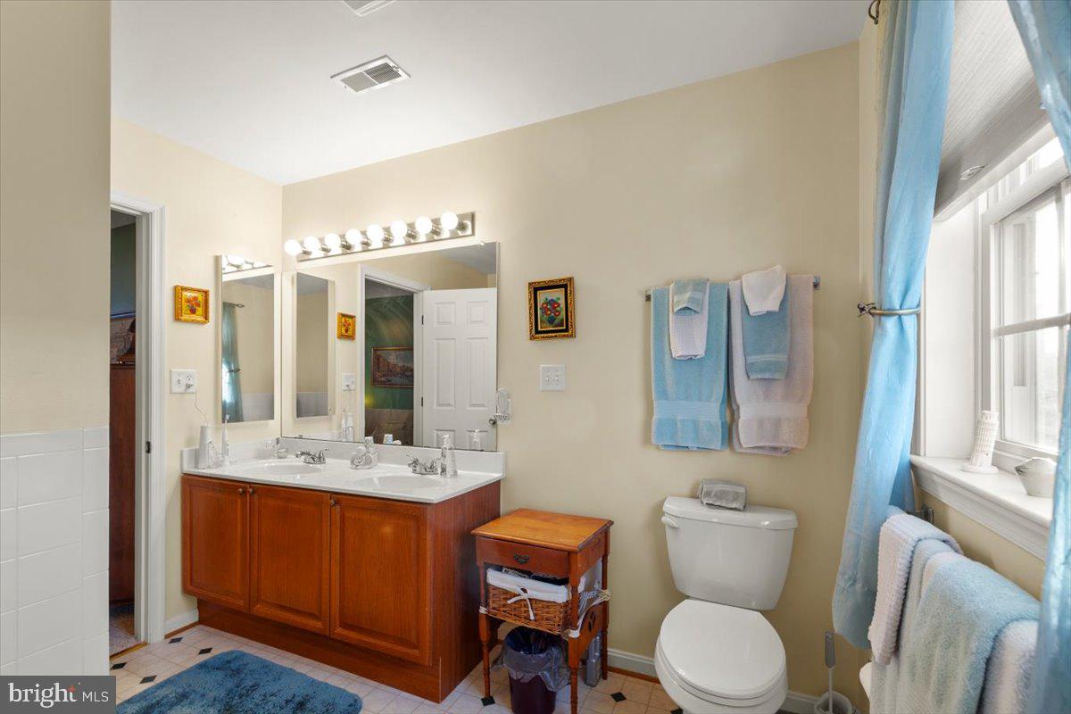 334 Friendship Lane Gettysburg, PA 17325 - Photo 45 of 64 a bathroom with a granite countertop sink mirror vanity and toilet