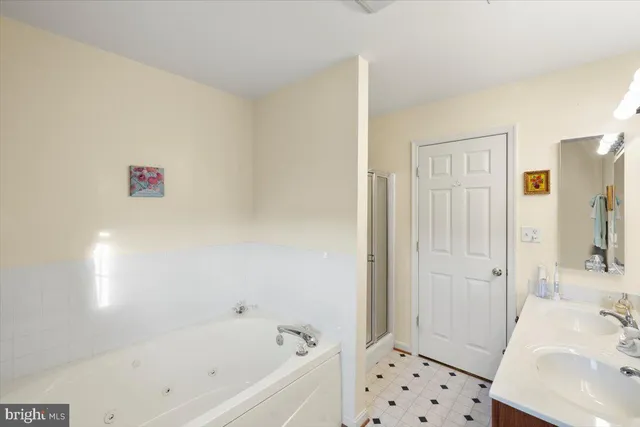 an aerial view of residential houses with outdoor space and swimming pool