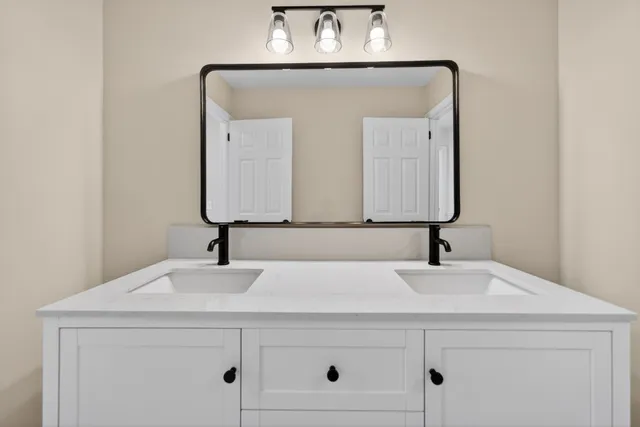 a sink with a mirror