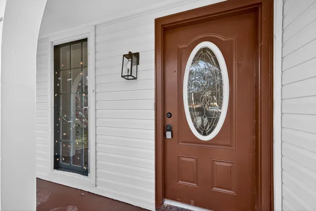 a front view of a house with a washer and dryer