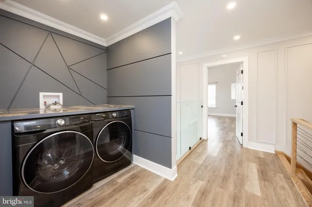 a view of a storage & utility room with wooden floor