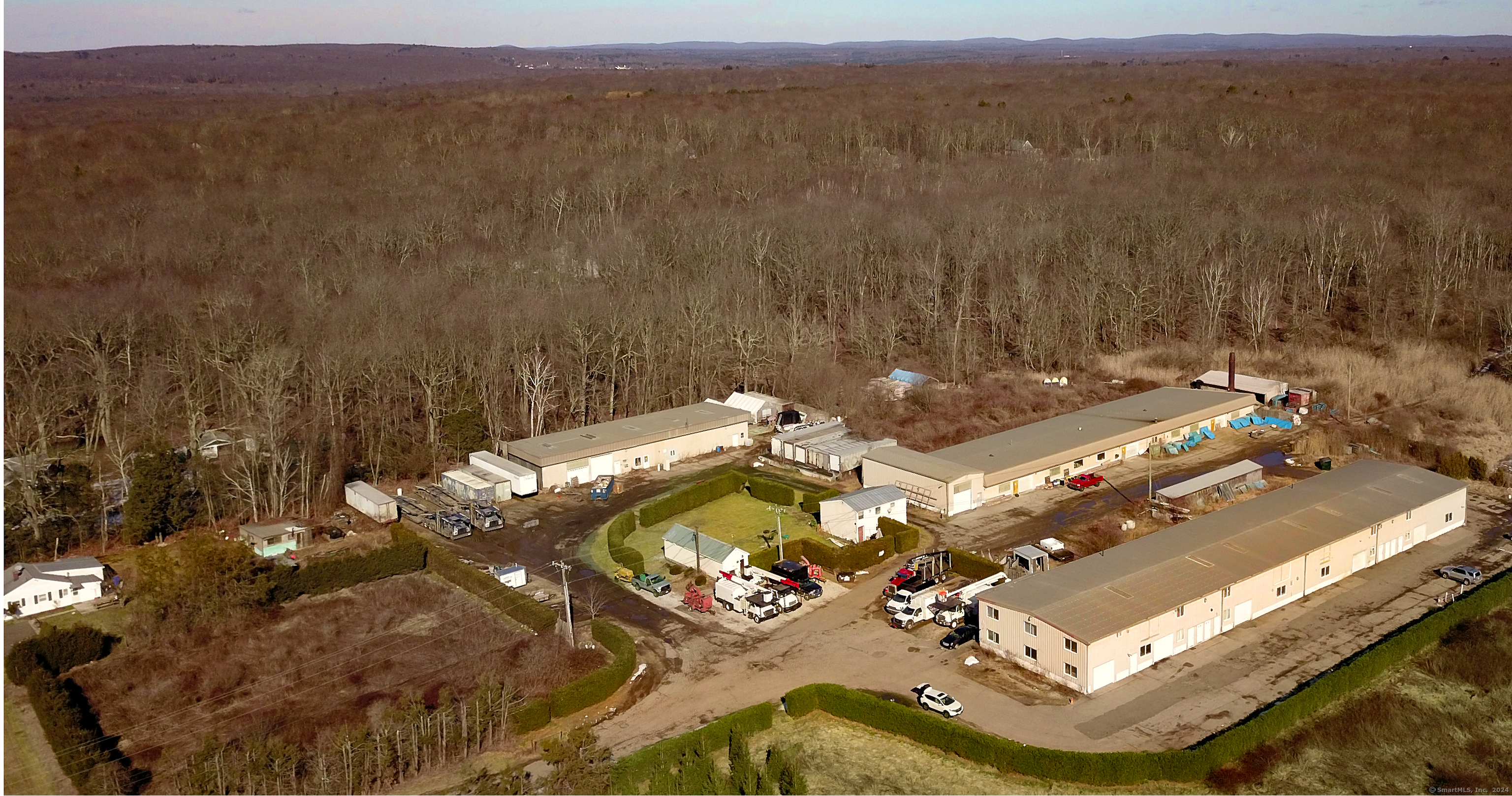 a view of a house with a mountain and a yard