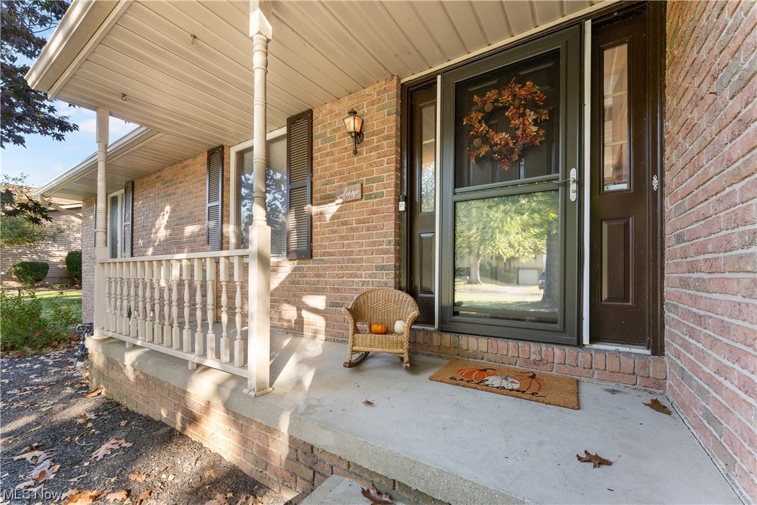 5226 Johnnycake Ridge Northeast Canton, OH 44705 - Photo 4 of 32 View of exterior entry featuring a porch