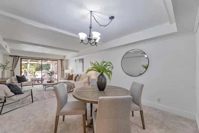 a view of a dining room with furniture window and outside view