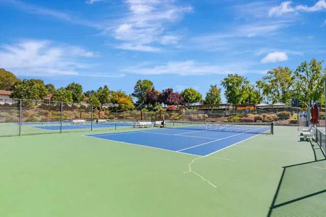 a view of an outdoor space and tennis court