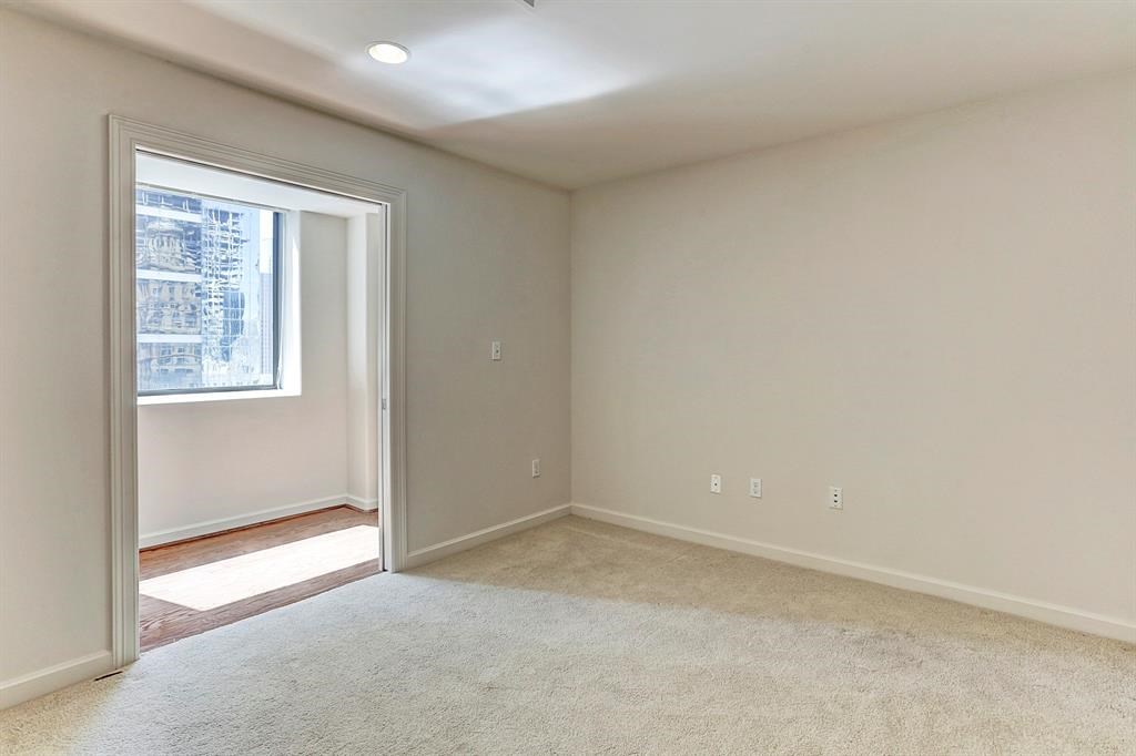 914 Main Street, Unit 1806 Houston, TX 77002 - Photo 8 of 21 an empty room with windows