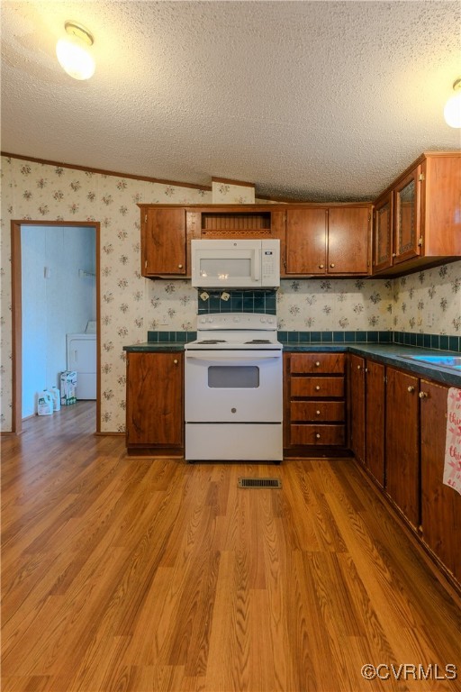 1455 Hendricks Road Pamplin, VA 23958 - Photo 13 of 37 Kitchen with white appliances, a textured ceiling,